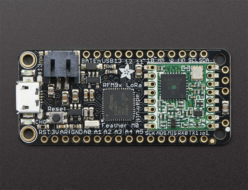 Two matching Feather M0 LoRa boards — source hardware reference