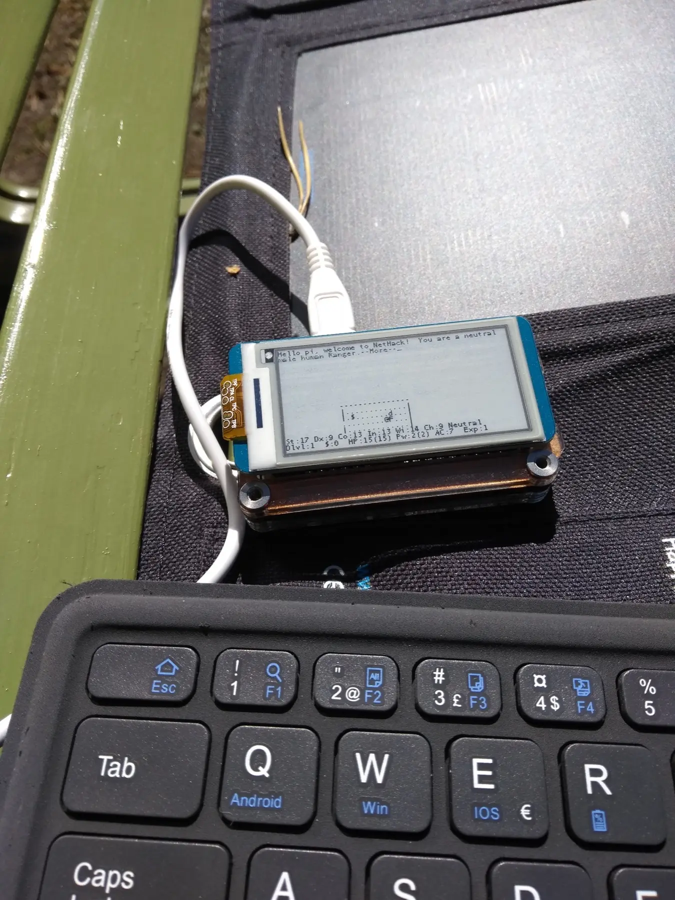 The upstream daylight example shows the reflective display in a different lighting condition.