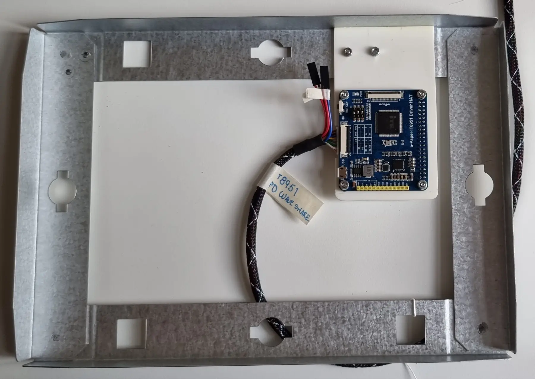The author’s frame-building guide shows the electronics mounted behind the panel.